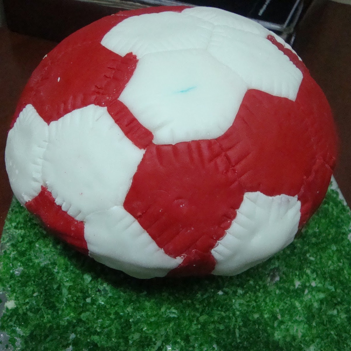 Football themed cake in red icing
