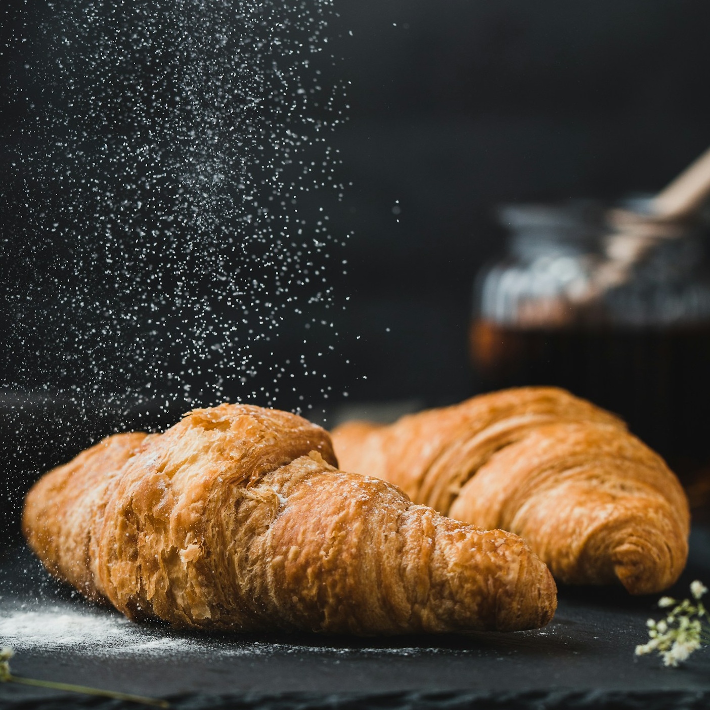 Flour dusted over fresh dough in a bakery training kitchen